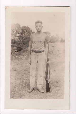 MISC - Military Man out of uniform but with medals, rifle - RPPC - 500996