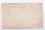 MISC - Military Man in uniform, cross on pocket, rifle in hand - RPPC - D06139