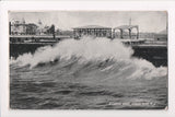 NJ, ASBURY PARK - Wave breaking with buildings shown - w00553