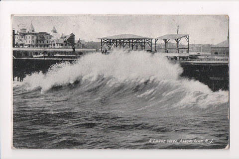 NJ, Asbury Park - Wave breaking with buildings shown - w00553