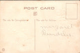 Easter - Anthropomorphic rabbits sitting in chairs eating postcard - SL2960