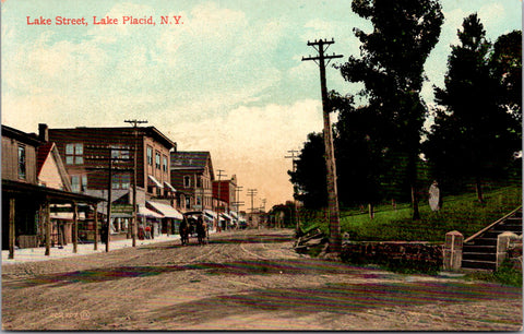 NY, LAKE PLACID - Lake St scene, horse wagon, buildings etc postcard - A19450