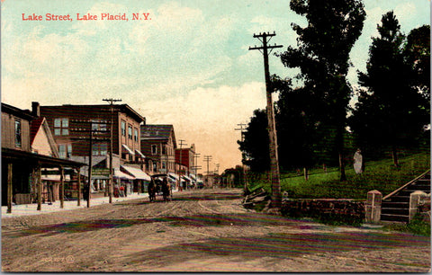 NY, Lake Placid - Lake St scene, horse wagon, buildings etc postcard - A19450