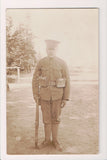 Military Man in uniform - posing with rifle - RPPC - B08298