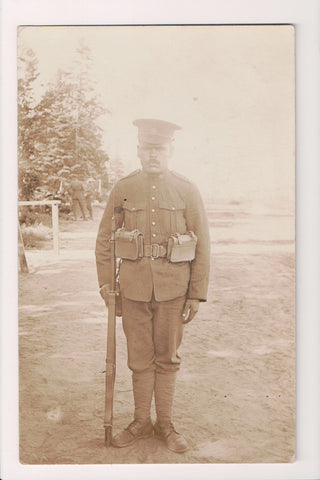 Military Man in uniform - posing with rifle - RPPC - B08298