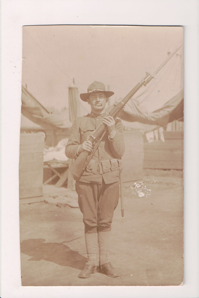 Military Man in uniform - posing with rifle, bayonet - RPPC - C08600