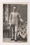 Military Man in uniform - posing - RPPC - w00536